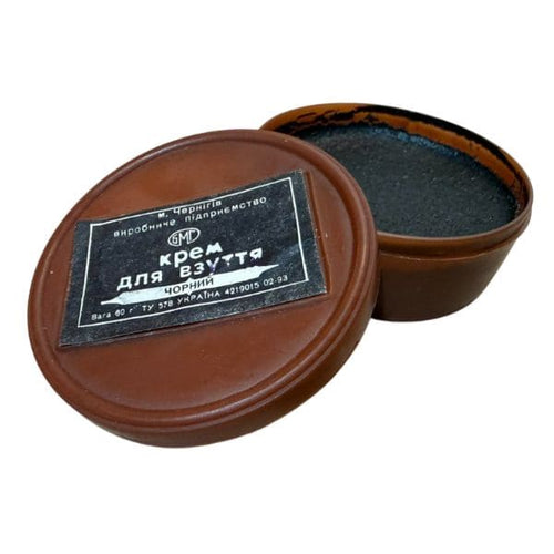 Original Soviet Afghan War black boot cream with opened container showing authentic military boot polish.
