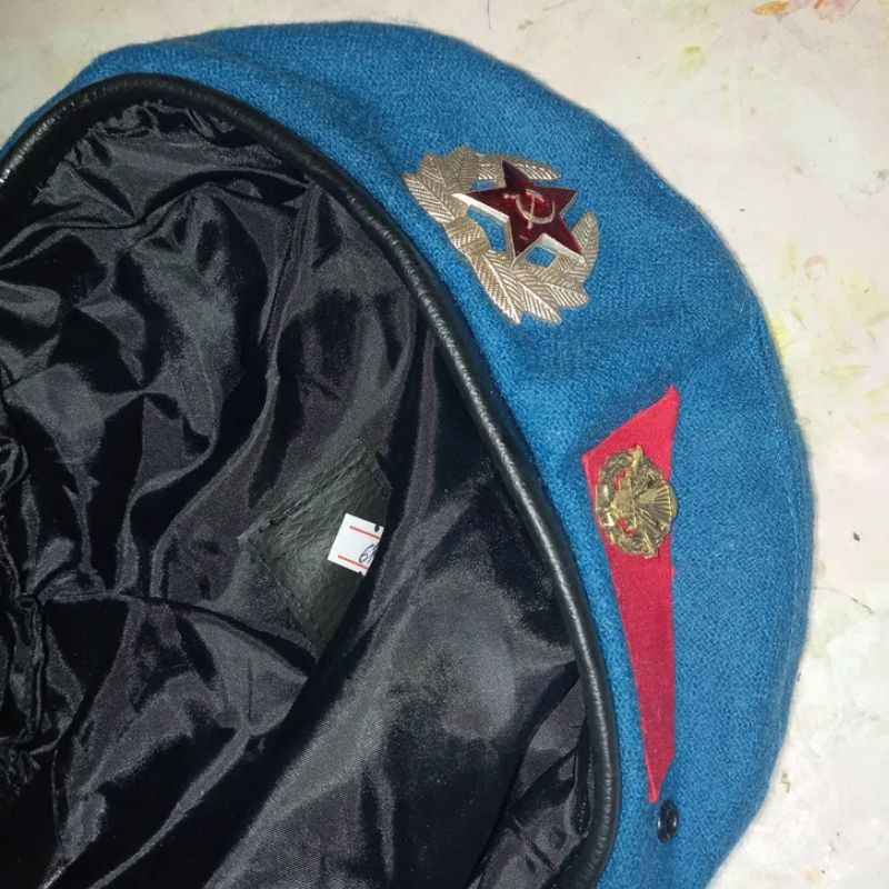 Original USSR VDV blue beret showing inner lining and Soviet insignia