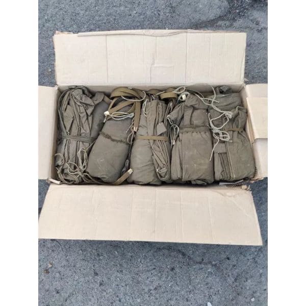 Original Soviet Veshmeshok backpacks in authentic military surplus warehouse stock.